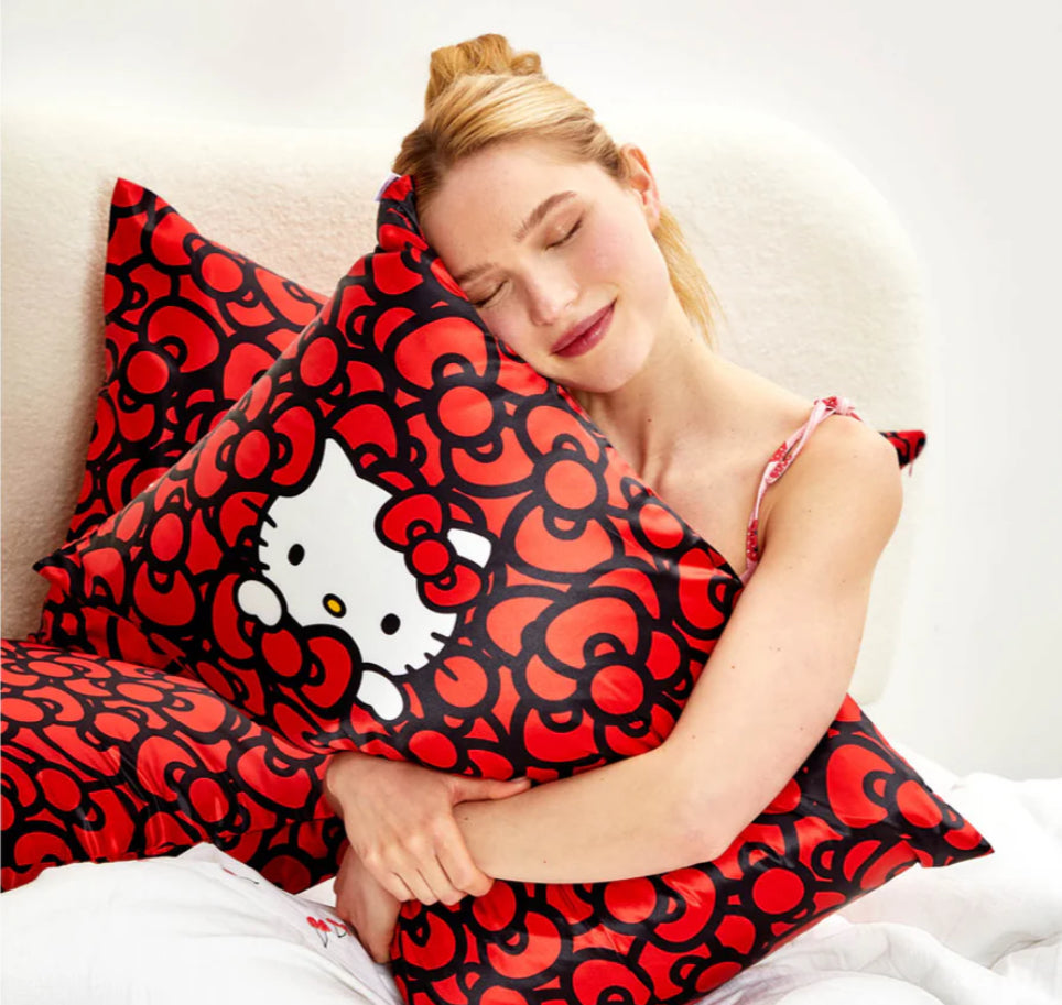 Kitsch x Hello Kitty Satin Pillowcase in Kitty Bathes in a Sea of Bows