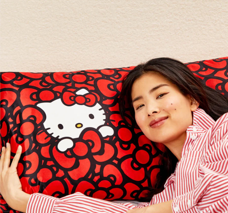 Kitsch x Hello Kitty Satin Pillowcase in Kitty Bathes in a Sea of Bows
